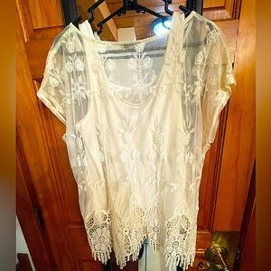 Gorgeous Lace top, matching tank, beautiful fringe like accents on bottom.